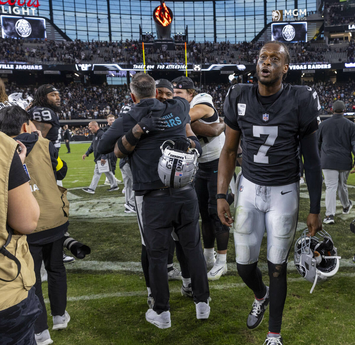 Raiders quarterback Geno Smith (7) yells at another player on the field after losing to the Jac ...