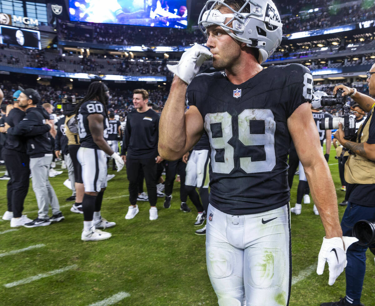 Raiders tight end Brock Bowers (89) chews on a finger on the field after losing to the Jacksonv ...
