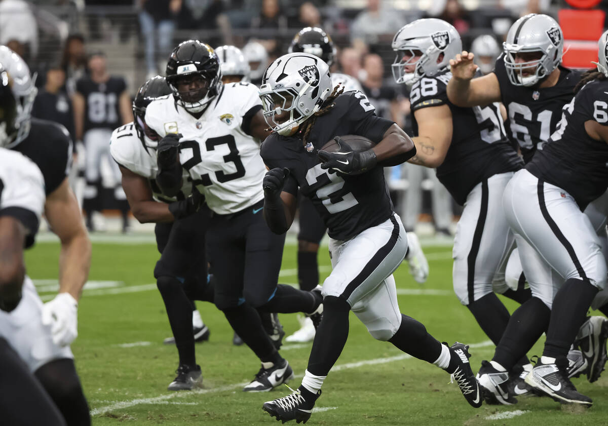Raiders running back Ashton Jeanty (2) runs the ball against the Jacksonville Jaguars during th ...