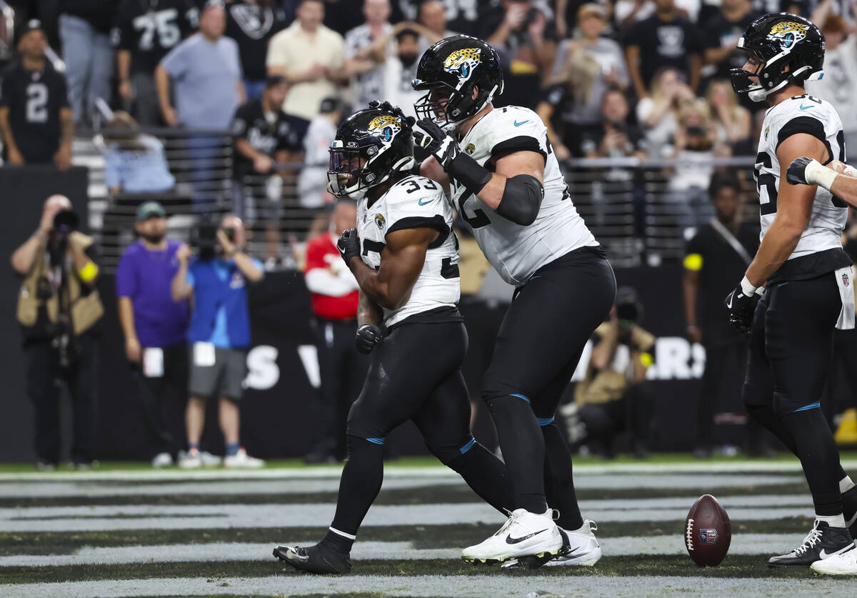 Jacksonville Jaguars running back Bhayshul Tuten (33) reacts after scoring a touchdown against ...