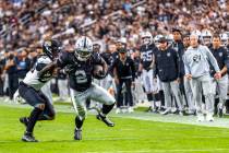 Raiders running back Ashton Jeanty (2) breaks a tackle attempt by Jacksonville Jaguars safety A ...