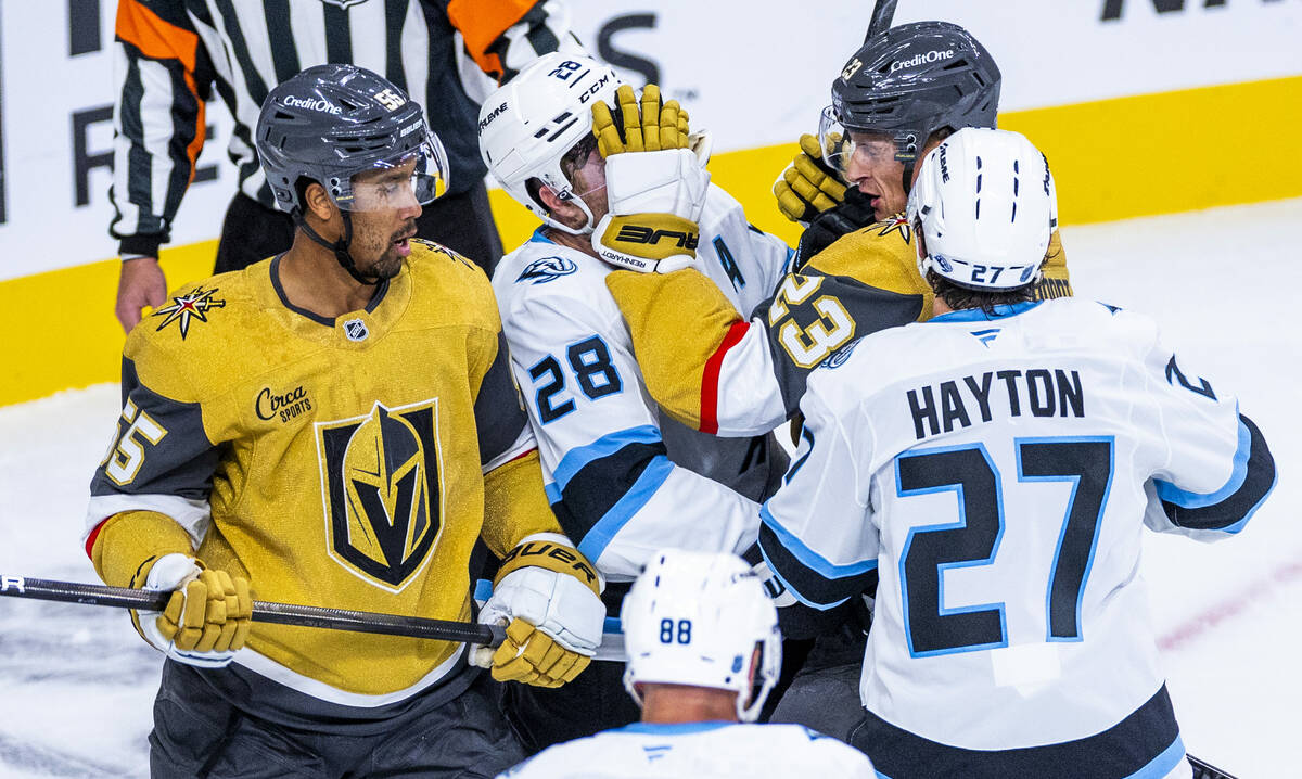 Utah Mammoth defenseman Ian Cole (28) gets a glove to the face from Golden Knights left wing Co ...