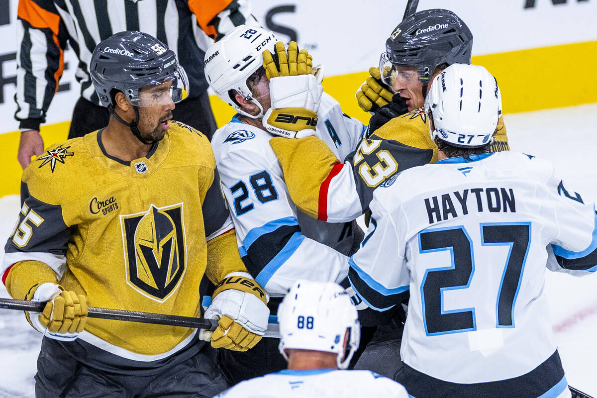 Utah Mammoth defenseman Ian Cole (28) gets a glove to the face from Golden Knights left wing Co ...