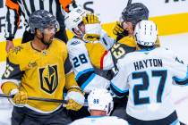 Utah Mammoth defenseman Ian Cole (28) gets a glove to the face from Golden Knights left wing Co ...
