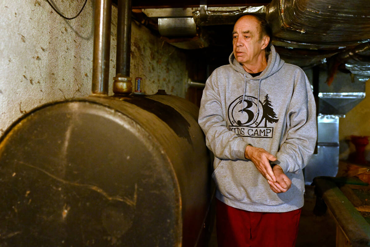 Mark Bain, who is part of the Low Income Home Energy Assistance Program, rubs his hands togethe ...