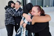 Jeanne Llera, mother of Jorge Gomez, right, hugs Desiree Smith, founder of More Than A Hashtag, ...
