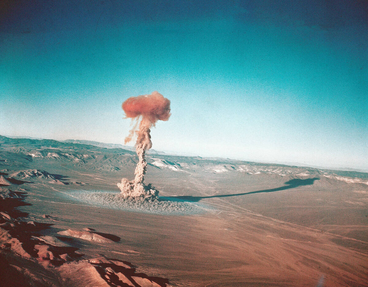 FILE - A sub-surface atomic test is shown March 23, 1955 at the Nevada Test Site near Yucca Fla ...