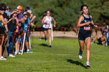 Somerset Academy Sky Pointe High School runner Aislin McMahon (1269) nears the finish line ...