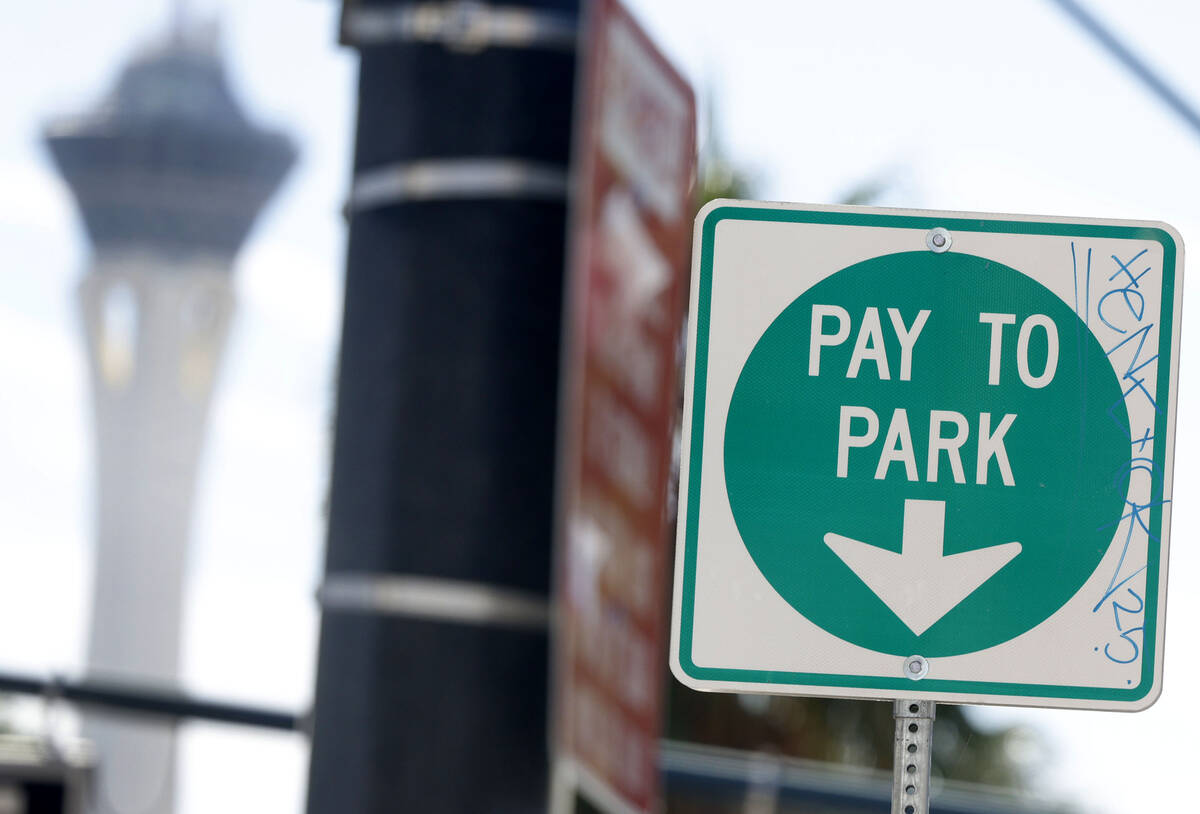 A "Pay to Park" sign near a parking meter operated by the city of Las Vegas is seen on Third St ...