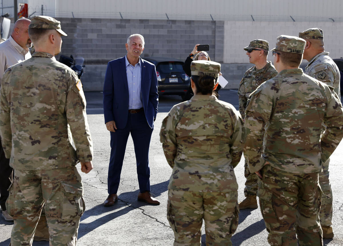 Gov. Joe Lombardo speaks to members of the National Guard after touring Three Square on Monday, ...
