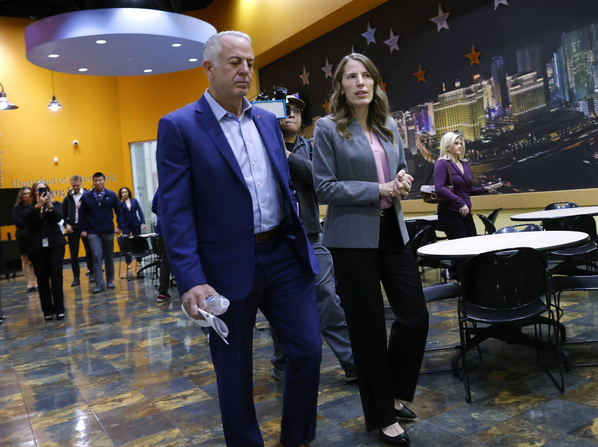 Three Square President & CEO Beth Martino leads Gov. Joe Lombardo on a tour of Three Square ...
