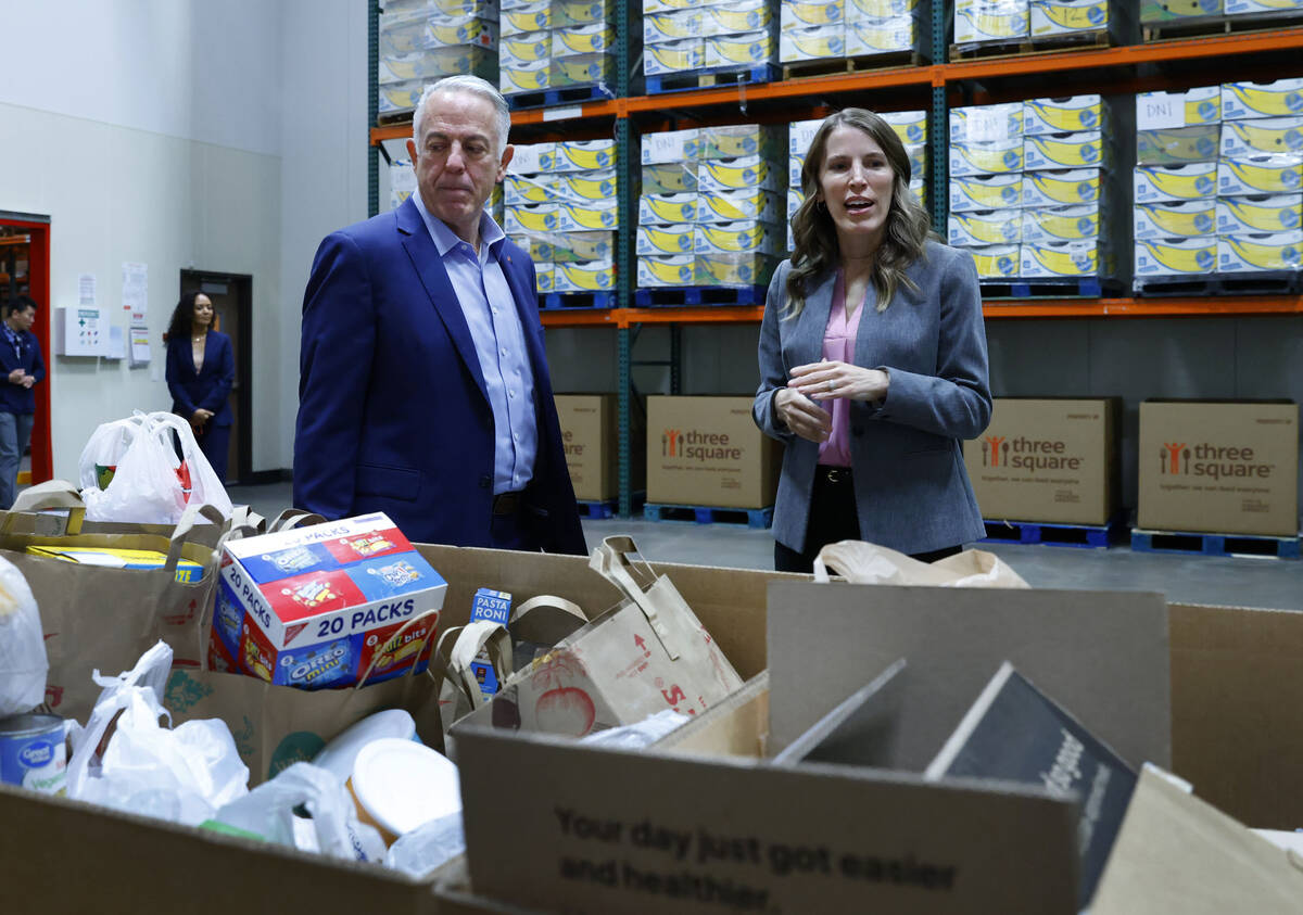 Three Square President & CEO Beth Martino leads Gov. Joe Lombardo on a tour of Three Square ...