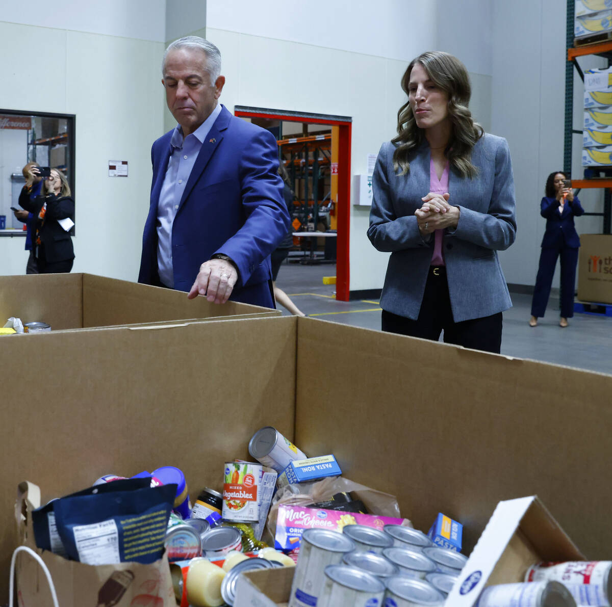 Three Square President & CEO Beth Martino leads Gov. Joe Lombardo on a tour of Three Square ...