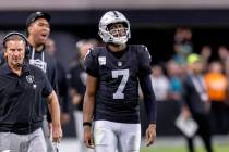 Raiders quarterback Geno Smith (7) looks to a replay screen during the second half of an NFL ga ...