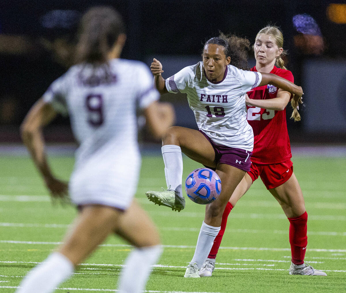 Faith Lutheran's Briana Lee (19) controls the ball against Coronado's Rebecca Shuler ...