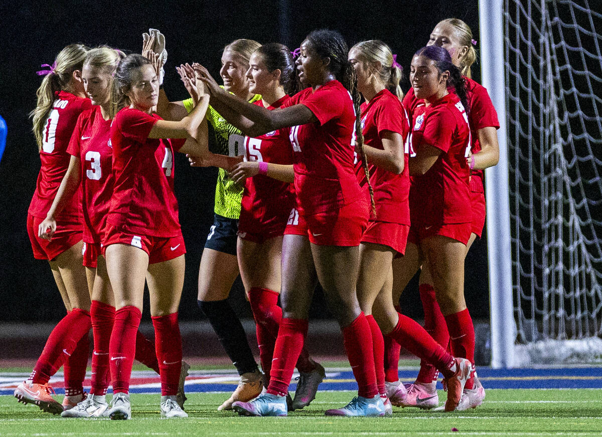 Coronado players celebrate their 1-0 win over Faith Lutheran in their NIAA girl's soccer m ...