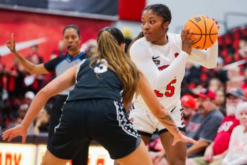 Lady Rebels guard Aaliyah Alexander (25) looks to pas the ball during a Women's Basketball ...