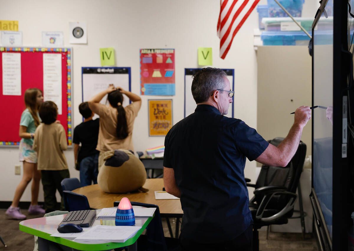 Roger Becker, a fifth-grade math teacher at Richard Bryan Elementary School, teaches on Tuesday ...