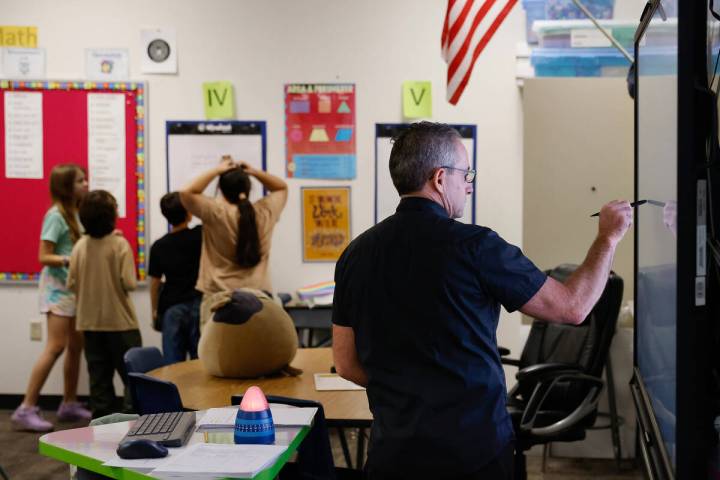 Roger Becker, a fifth-grade math teacher at Richard Bryan Elementary School, teaches on Tuesday ...