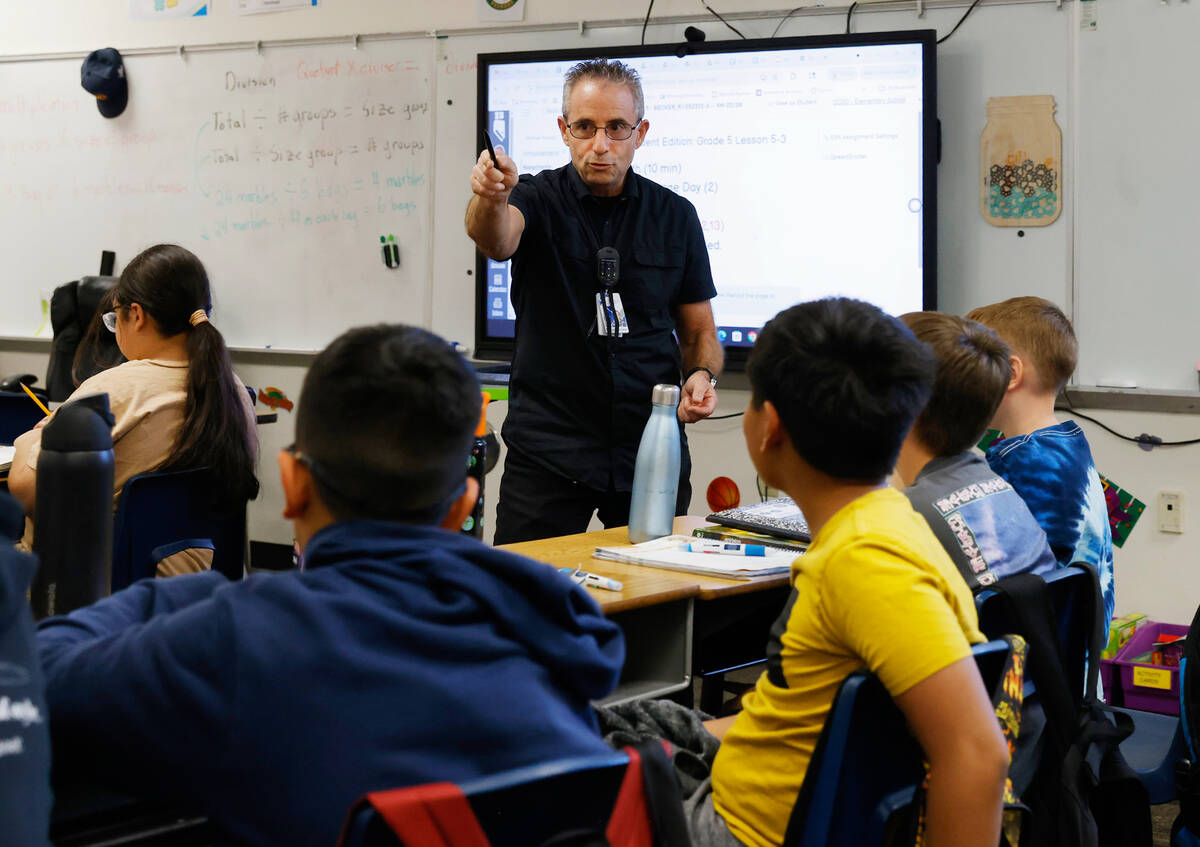Roger Becker, a fifth-grade math teacher at Richard Bryan Elementary School, teaches on Tuesday ...