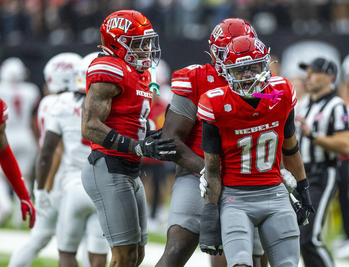 UNLV defensive back Tre Fulton (10) and teammates celebrate a critical third-down stop against ...