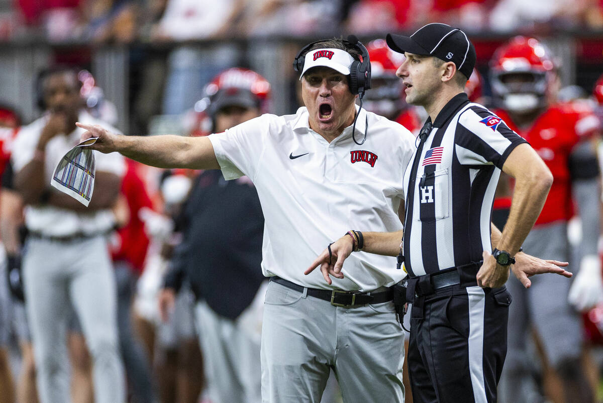 UNLV head coach Dan Mullen argues with an official against the New Mexico Lobos during the seco ...