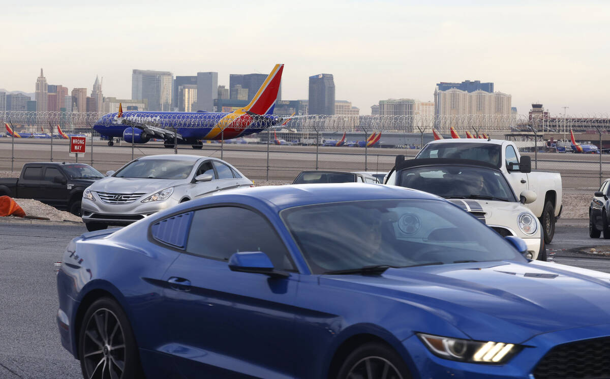 Motorists navigate on Sunset Road after exiting from the Airport Connector Interchange off-ramp ...