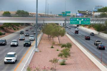 Motorists navigate on Airport Connector Interchange near Sunset Road off-ramp on Thursday, Aug ...