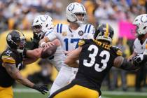 Indianapolis Colts quarterback Daniel Jones (17) looks to pass during an NFL football game agai ...