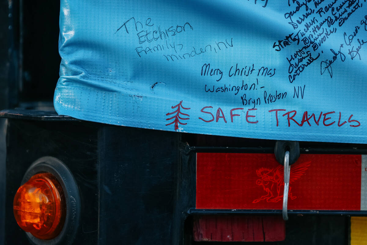 Countless signatures and holiday messages cover the truck carrying the U.S. Capitol Christmas T ...