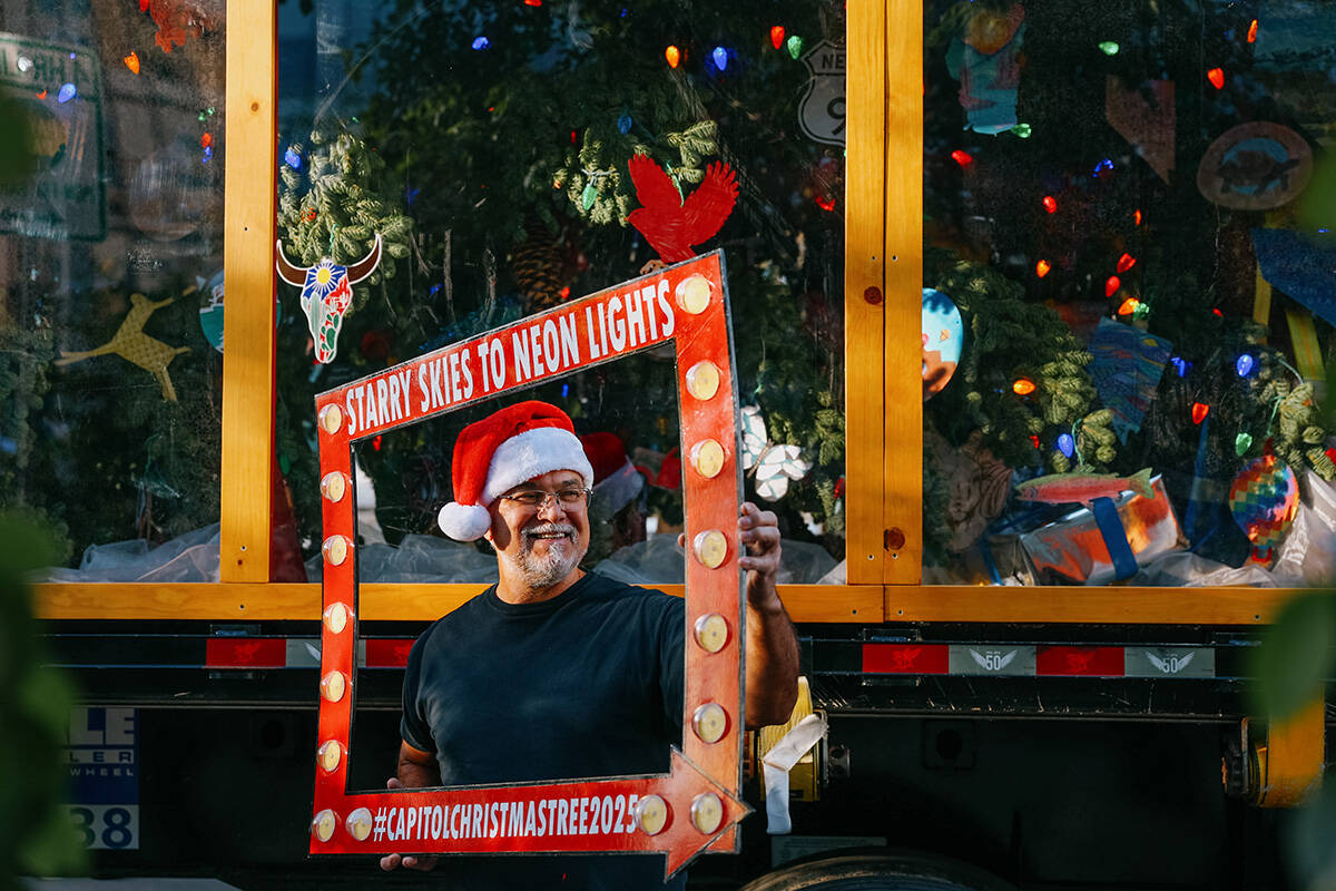 Paul Rusterholz poses for a photo in front of the U.S. Capitol Christmas Tree, nicknamed ȁ ...