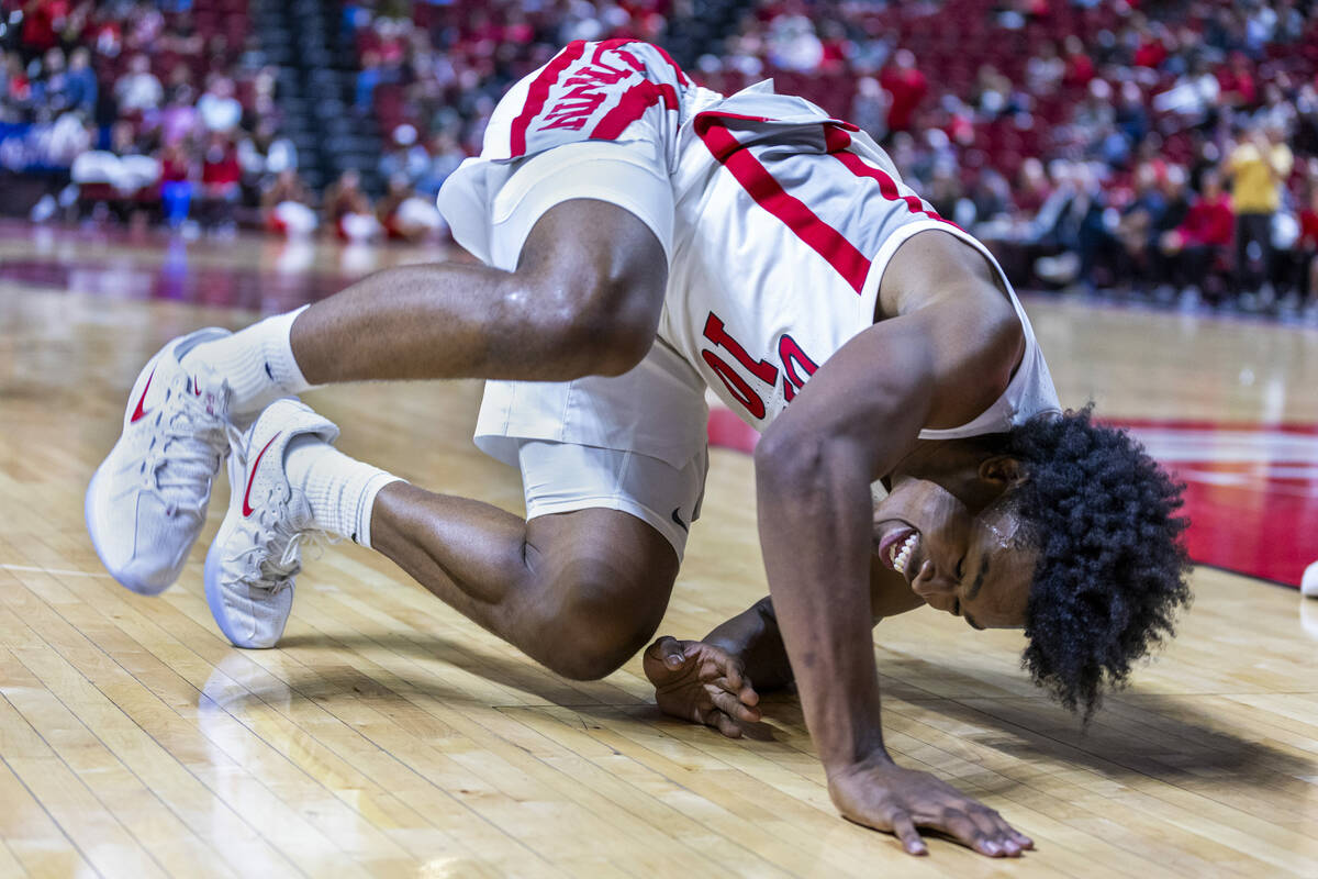 UNLV forward Jacob Bannarbie (10) rolls on the court after a foul from UT Martin Skyhawks forwa ...