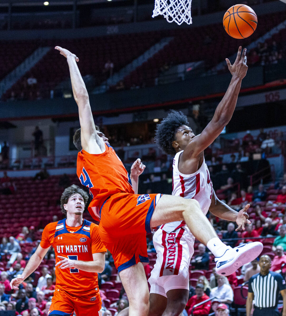 UNLV forward Jacob Bannarbie (10) gets inside of UT Martin Skyhawks forward Vladimir Khryapa (2 ...