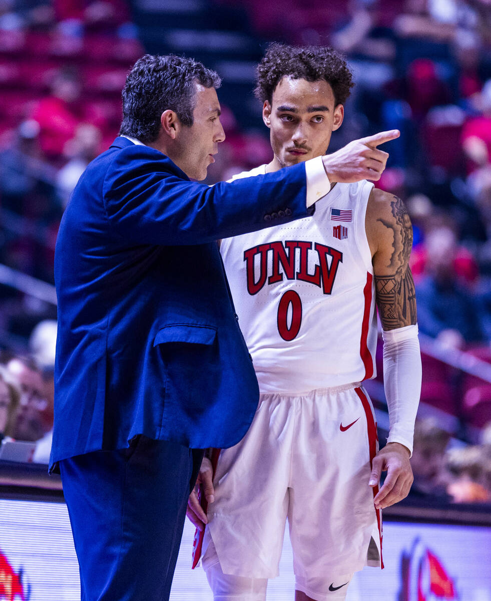 UNLV head coach Josh Pastner chats with guard Dra Gibbs-Lawhorn (0) on foul shots for the UT Ma ...