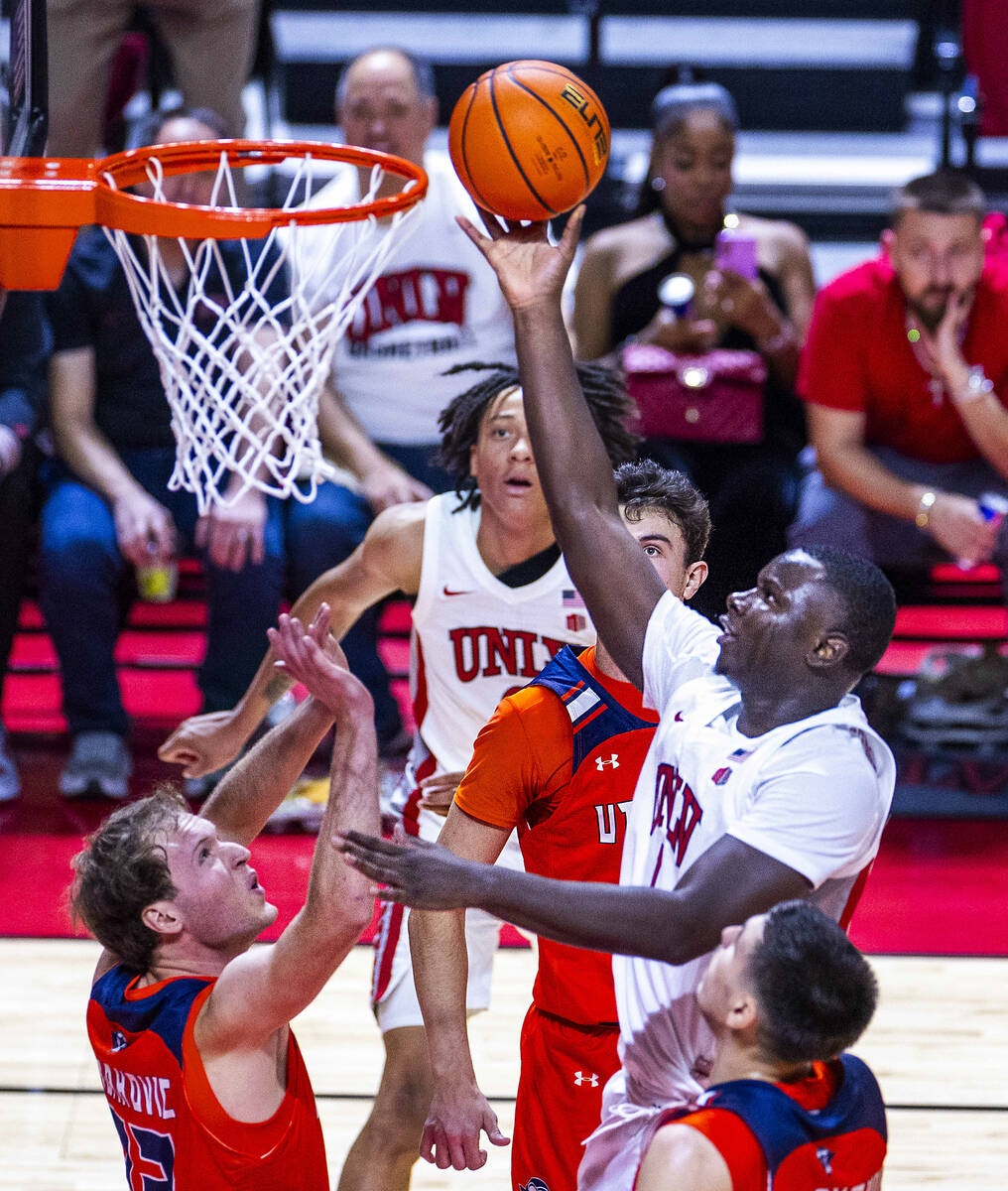 UNLV forward Ladji Dembele (1) elevates to tip in a basket over UT Martin Skyhawks guard Filip ...