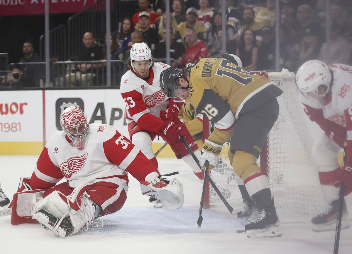 Golden Knights right wing Pavel Dorofeyev (16) tries to get the puck in against Detroit Red Win ...