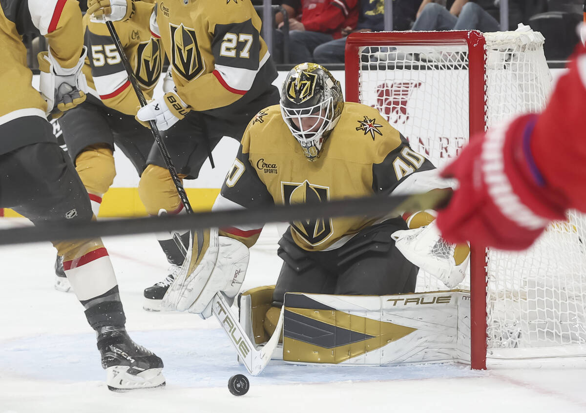 Golden Knights goaltender Akira Schmid (40) looks to stop the puck during the second period of ...