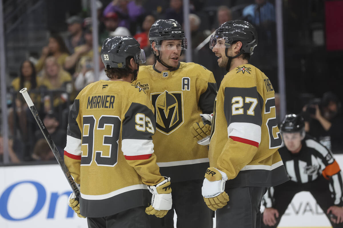 Golden Knights defenseman Brayden McNabb (3) talks with right wing Mitch Marner (93) and defens ...