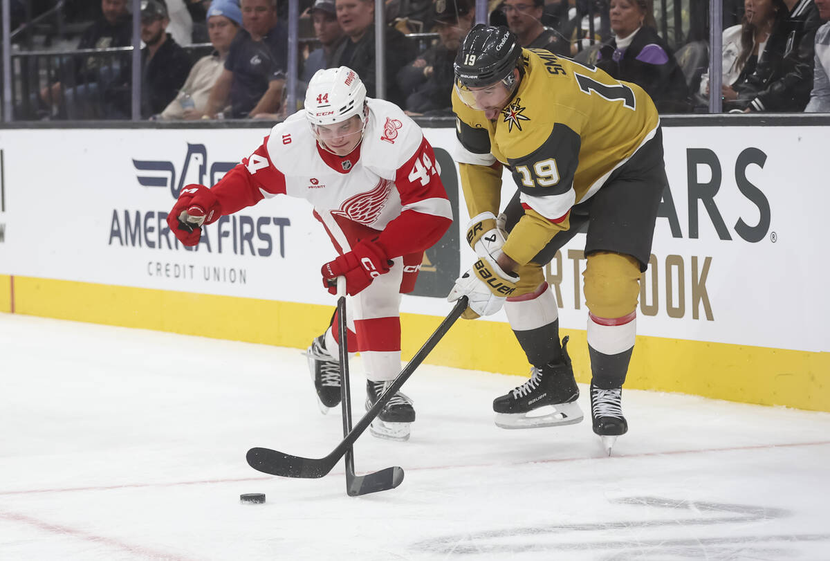 Golden Knights right wing Reilly Smith (19) and Detroit Red Wings defenseman Axel Sandin-Pellik ...