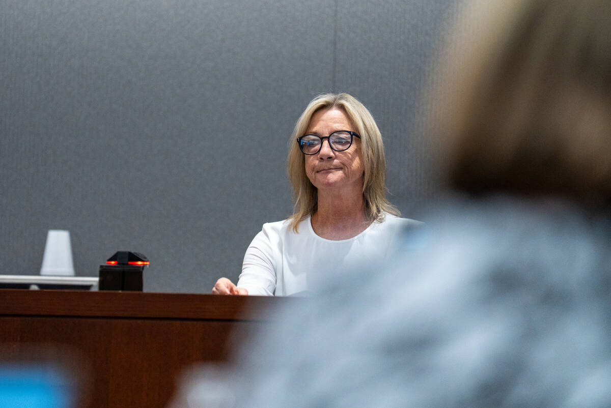 Mary Catherine Monahan, daughter of local dentist George Monahan, who was killed in 1980, speak ...