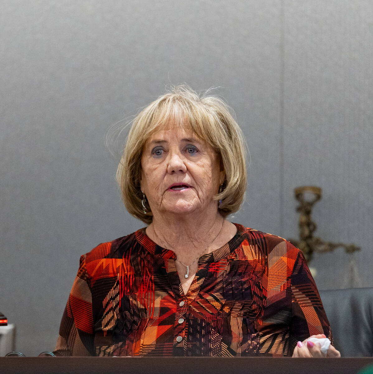 Mary Lou Walton, wife of local dentist George Monahan, who was killed in 1980, speaks to the co ...