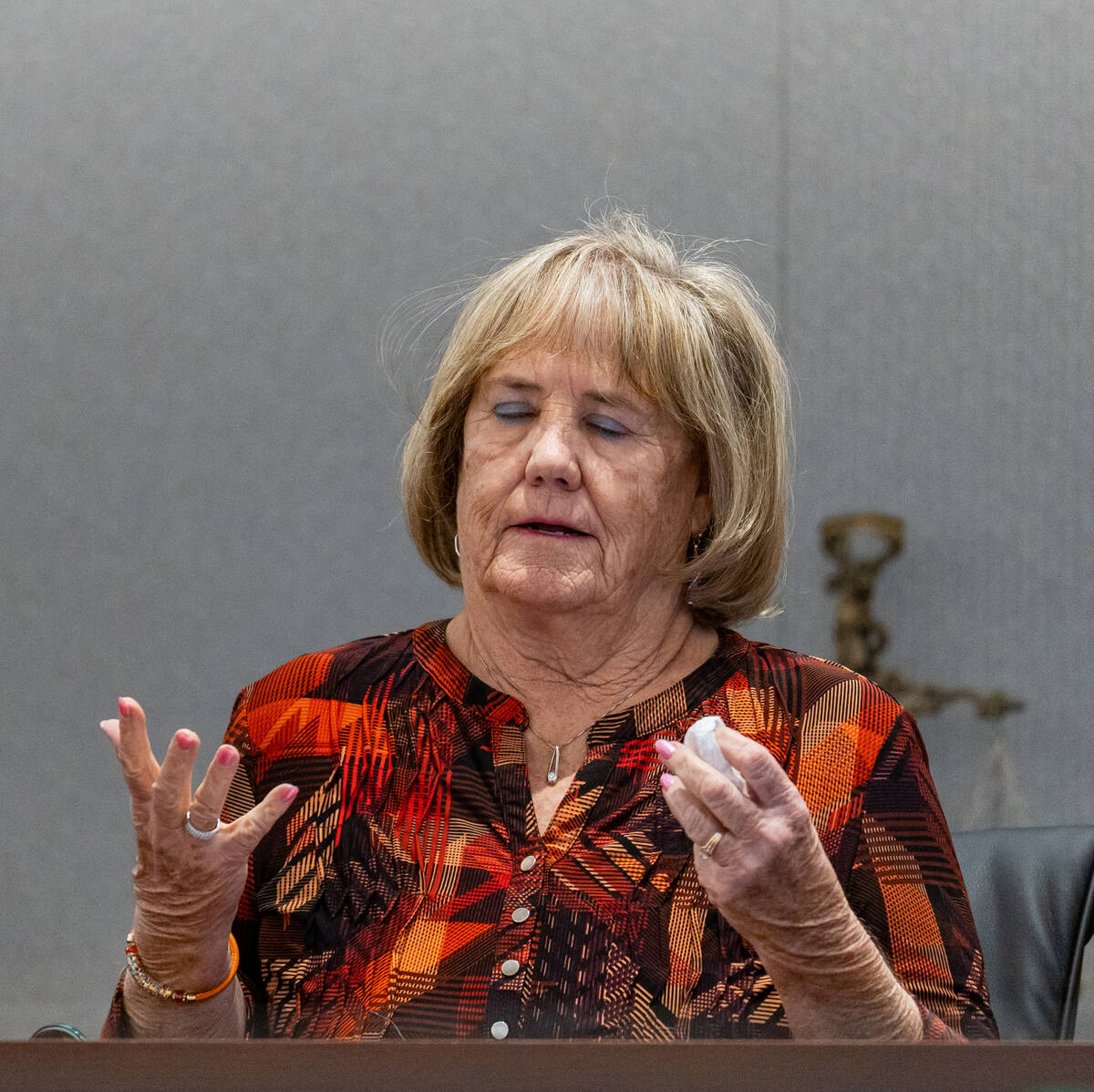 Mary Lou Walton, wife of local dentist George Monahan, who was killed in 1980, speaks to the co ...