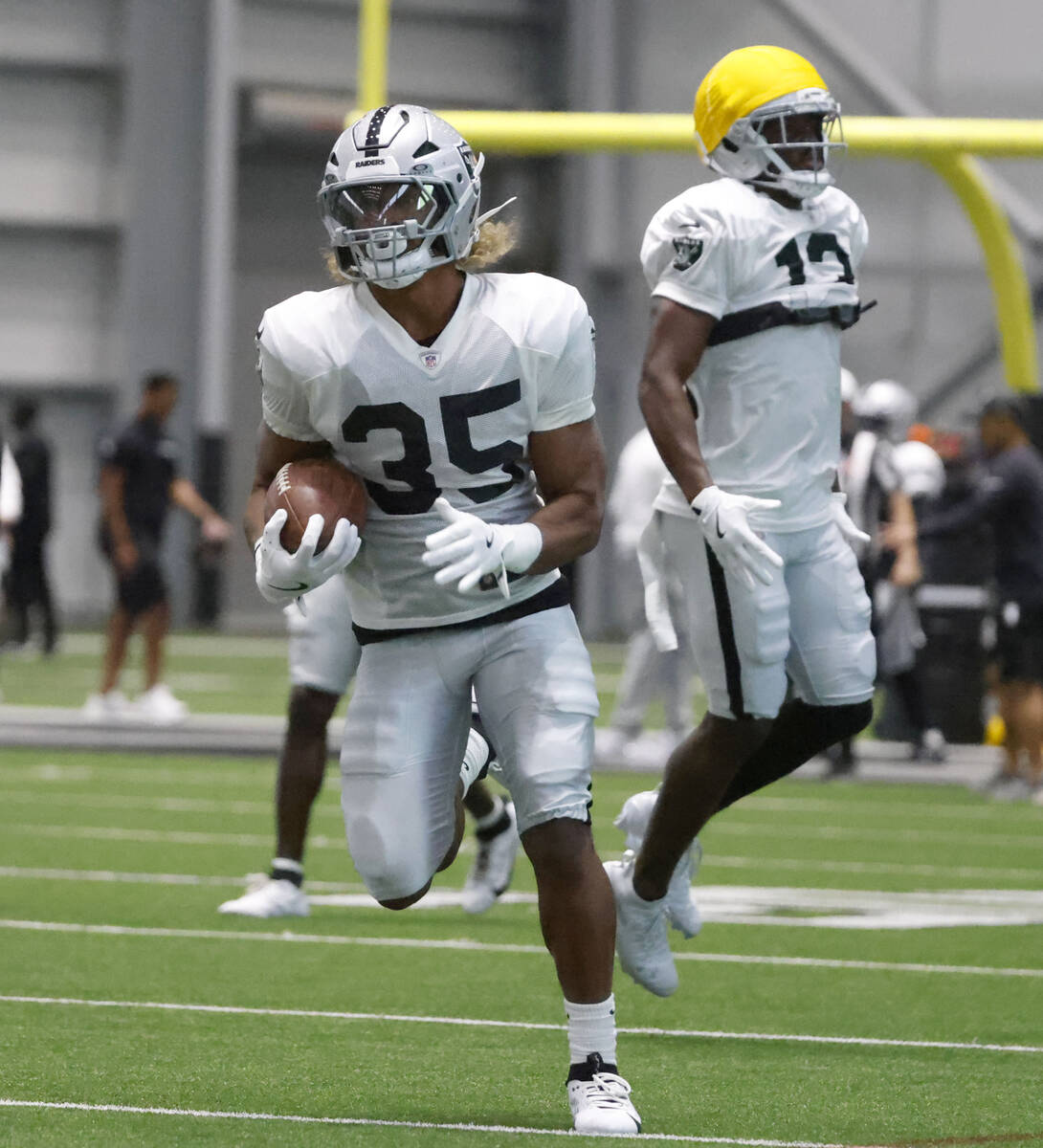 Raiders running back Chris Collier (35) runs with the ball during the team’s training ca ...