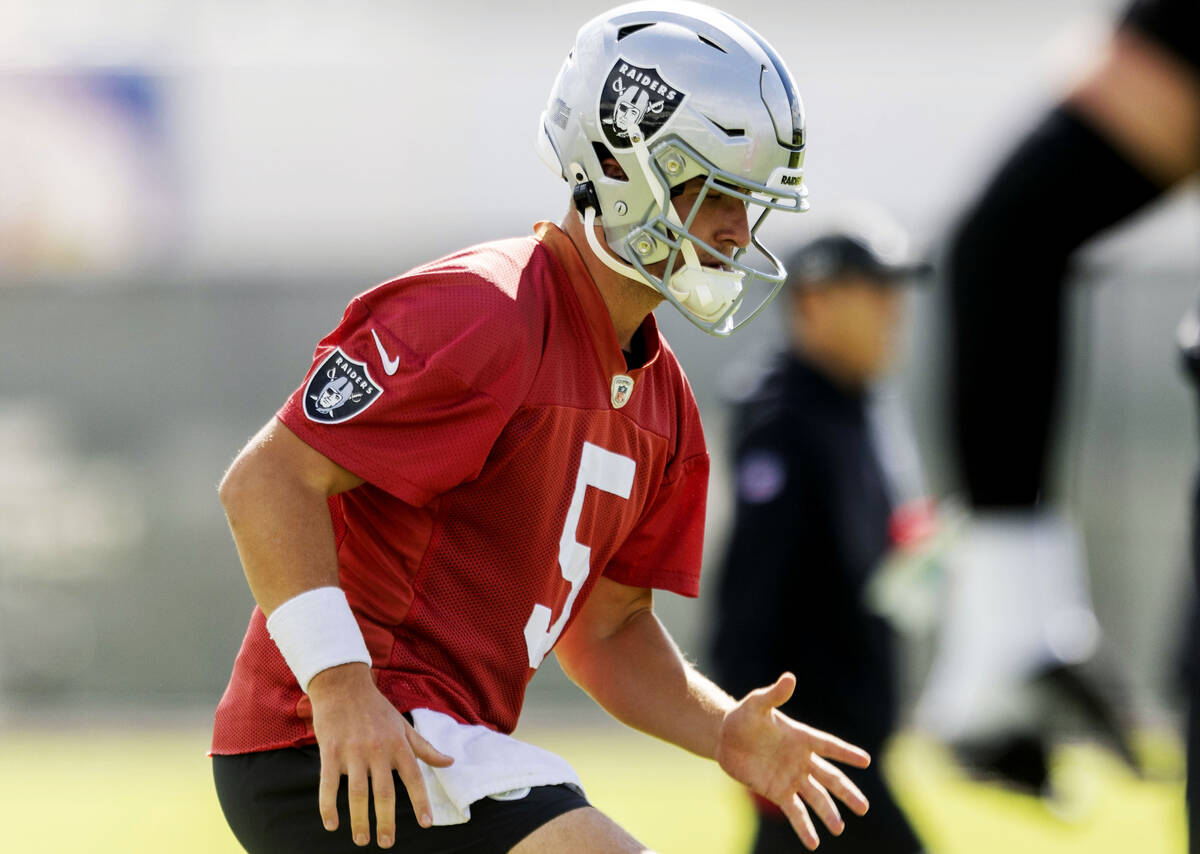 Raiders quarterback Cam Miller (5) warms up during the team’s practice at the Intermount ...