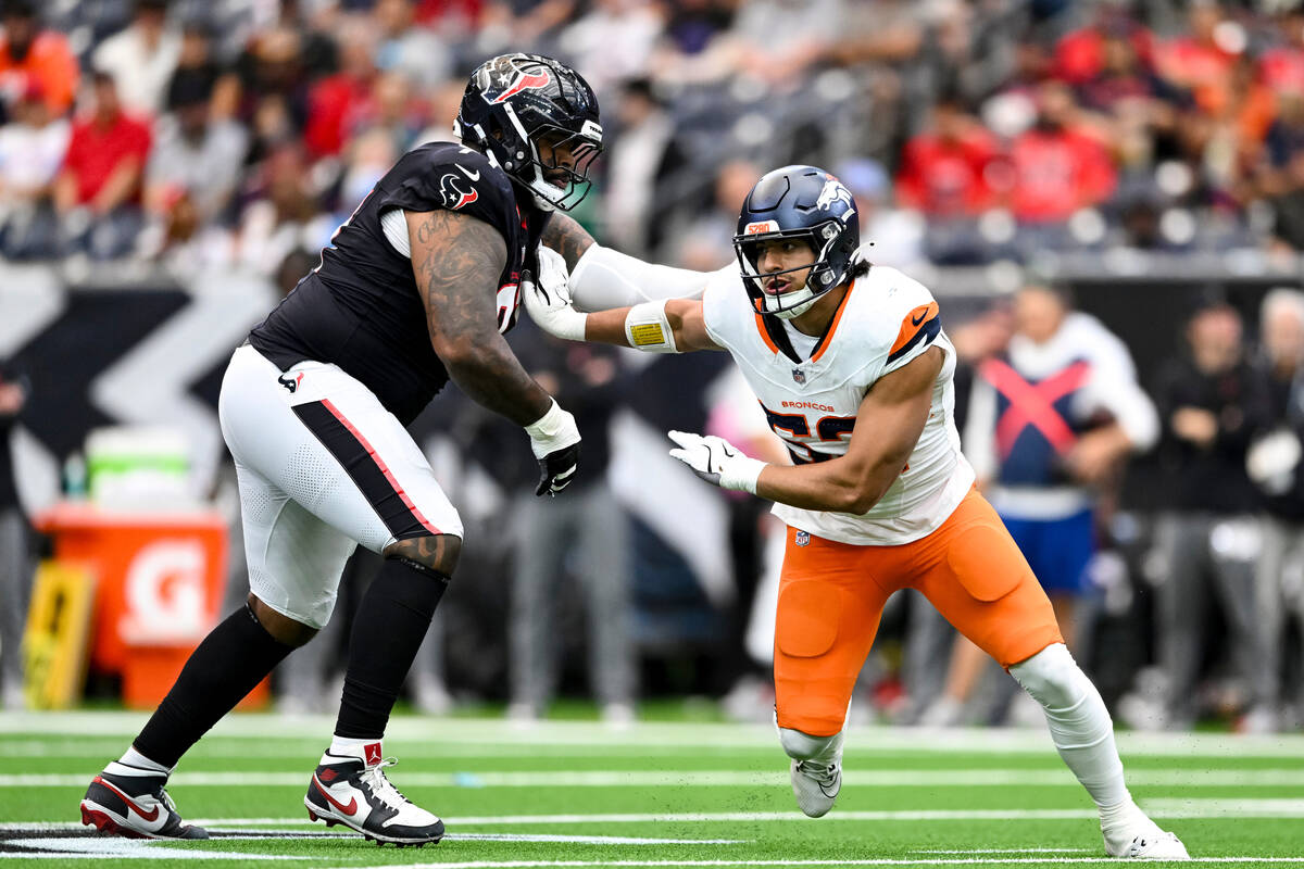 Denver Broncos linebacker Jonah Elliss (52) breaks the block from Houston Texans offensive tack ...