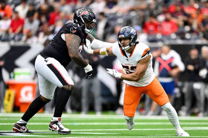 Denver Broncos linebacker Jonah Elliss (52) breaks the block from Houston Texans offensive tack ...