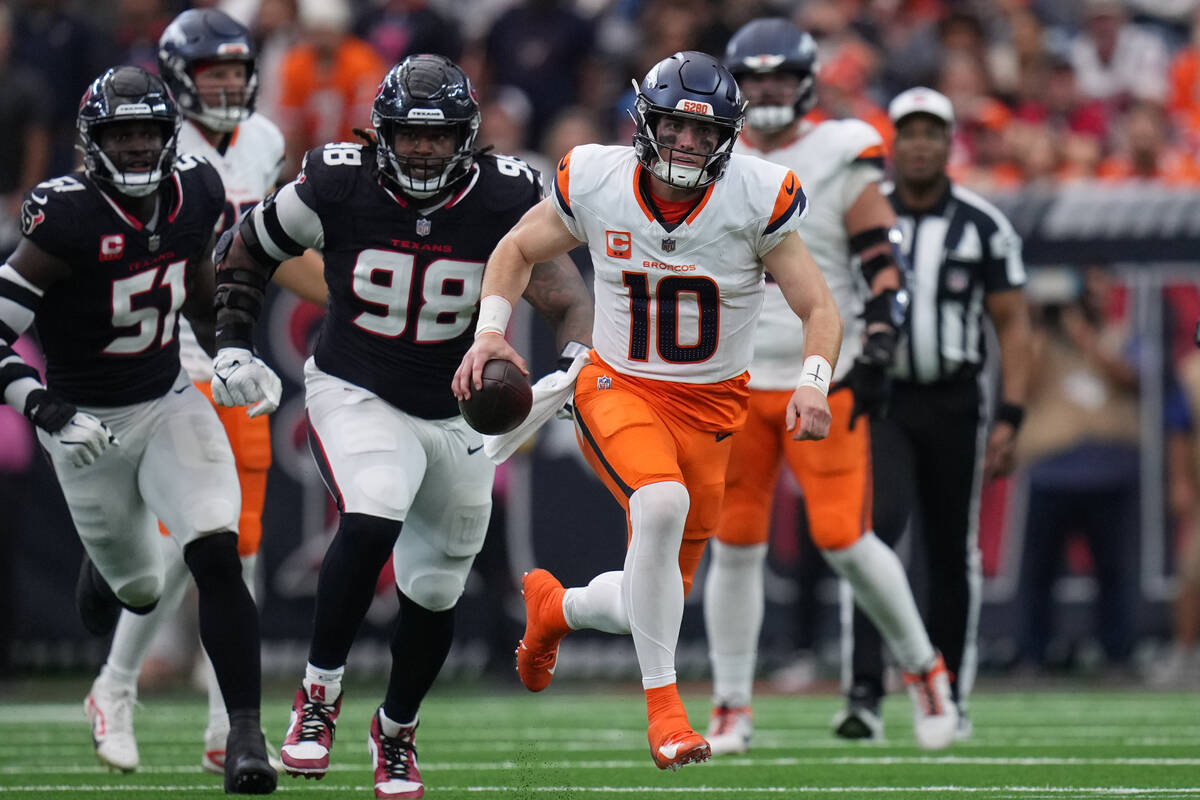 Denver Broncos quarterback Bo Nix (10) runs against the Houston Texans during an NFL football g ...