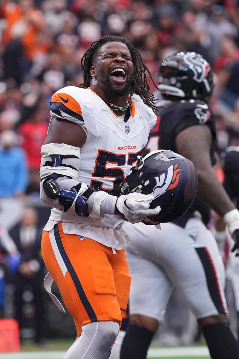 Denver Broncos linebacker Dre Greenlaw (57) reacts to a play against the Houston Texans during ...