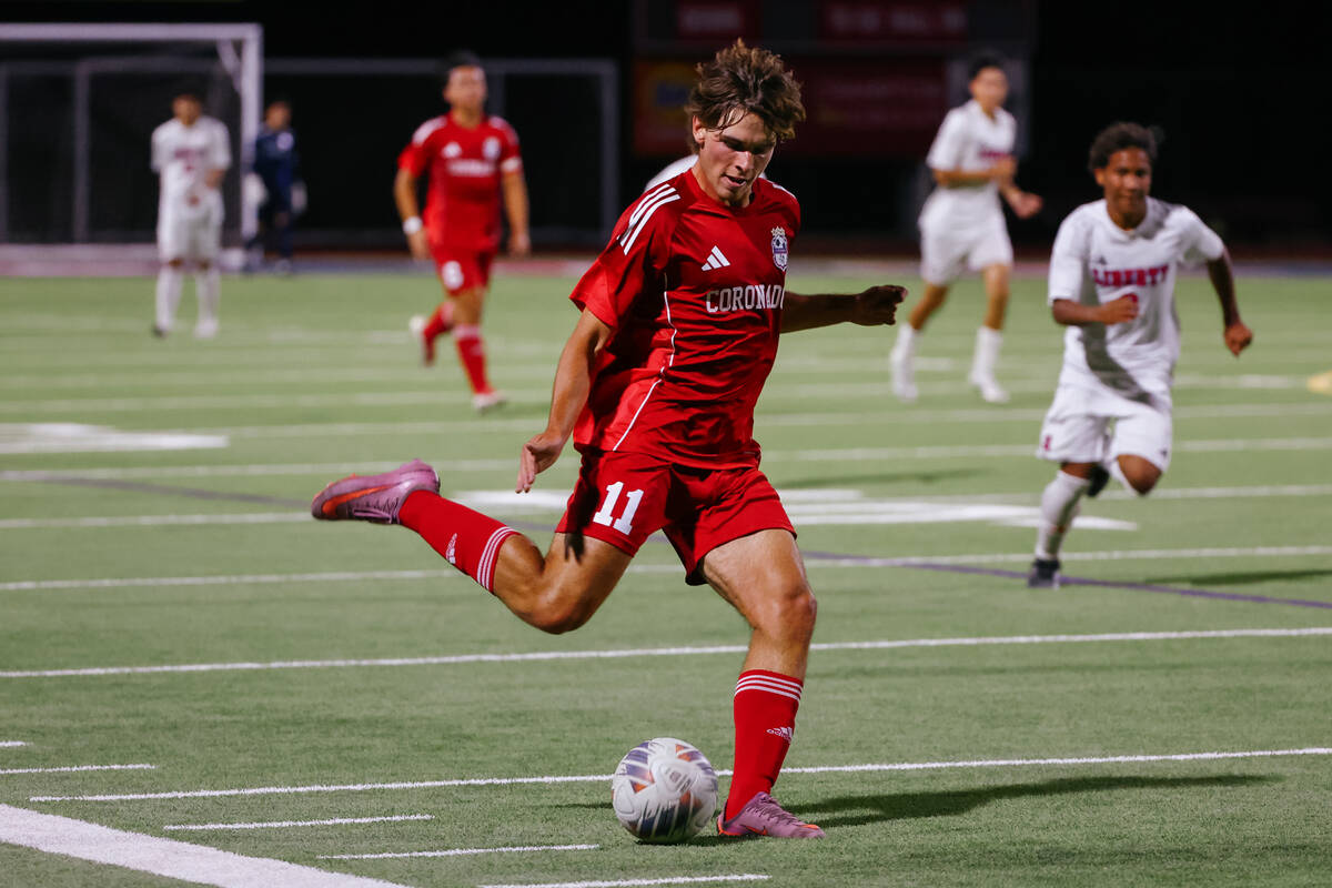 Coronado striker Gavin Flickinger (11) passes upfield to a teammate during the soccer game on T ...