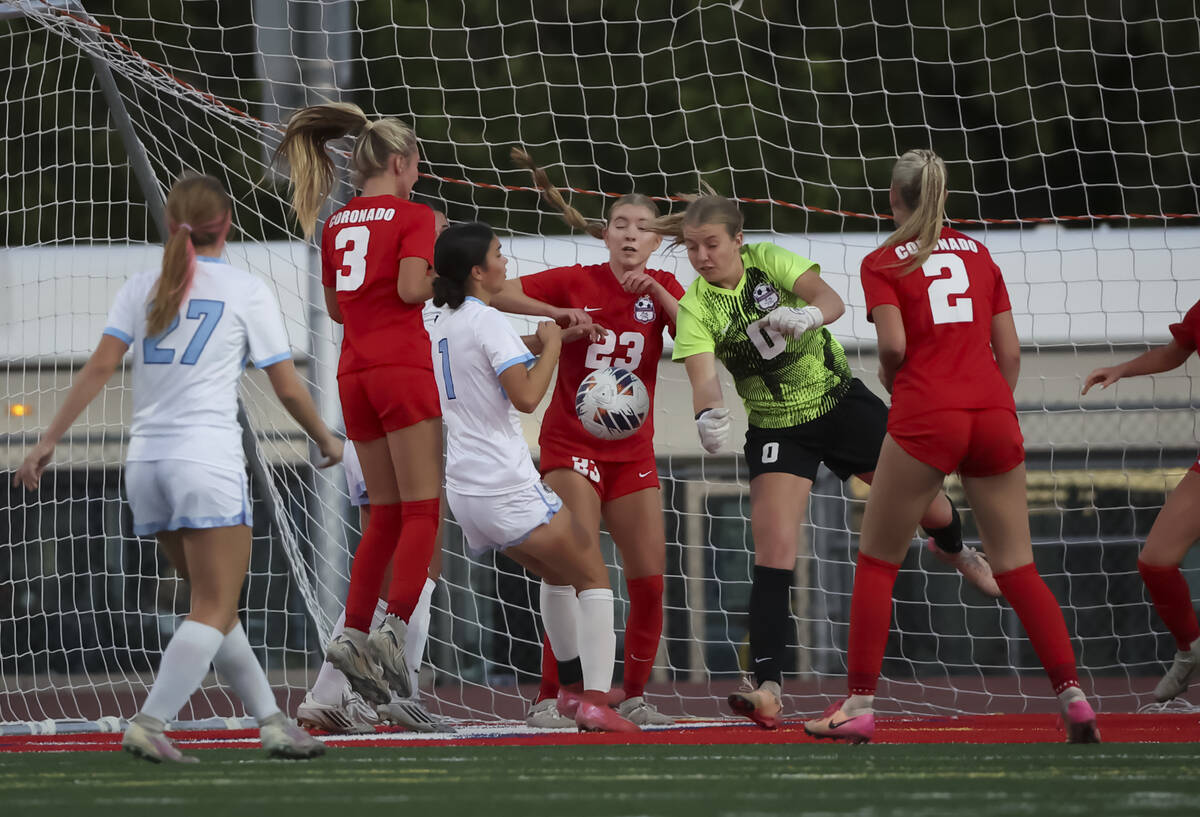 Coronado goalkeeper Lilian Foss (0) and defender Rebecca Shuler (23) protect the goal as Centen ...